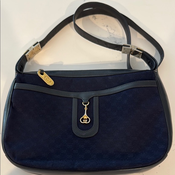 Gucci Micro GG Canvas shoulder bag in navy blue gold-tone hardware leather trim.